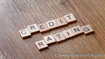Why did Moodyâ€™s improve its credit rating outlook from negative to stable?
