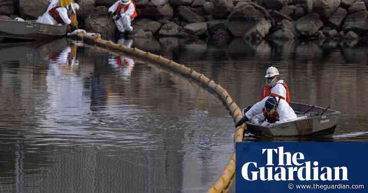 Huntington Beach oil spill blackens beaches and waves – in pictures