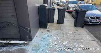 Watch as giant window falls out of Hackney house and almost hits dad and son on the head - My London