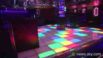 Coronavirus: Northern Ireland axes social distancing in bars and restaurants and allows nightclubs to reopen - Sky News