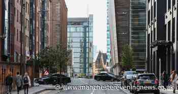Man, 23, fighting for life after falling from building in Manchester city centre
