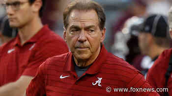 Nick Saban police escort barrels through Texas A&M fan storming field