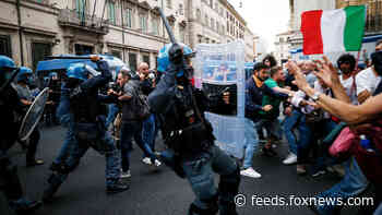Rome protesters clash with police as thousands pack the streets in opposition to COVID vaccine rule