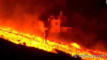 River of volcanic lava engulfs home