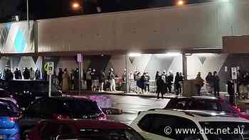 Queues at midnight outside Kmart stores as eager customers shop 'til they drop