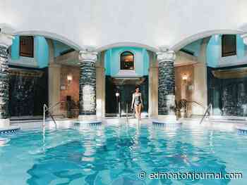 Enjoy the healing waters of a spa overlooking the mountains