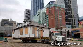 Calgary's iconic Eau Claire Lumber Company relocated amid plaza redesign - CTV News Calgary