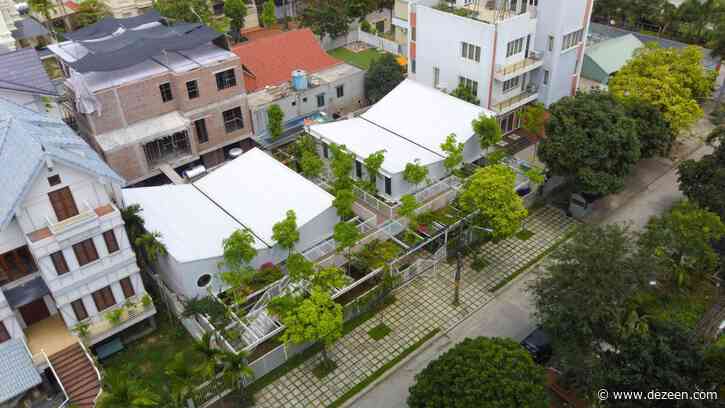 Plant-covered mesh panels surround preschool in Vietnam by HGAA