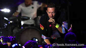 Chris Martin honors girlfriend Dakota Johnson during Coldplay concert: 'This is about my universe'