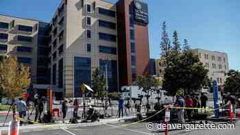 Members of media wait outside University of California Irvine Medical Center after it was announced that former U.S. President Bill Clinton was admitted to the hospital in Orange - Denver Gazette