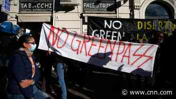 Thousands of Italians protest a strict new law requiring workers to have a Covid shot