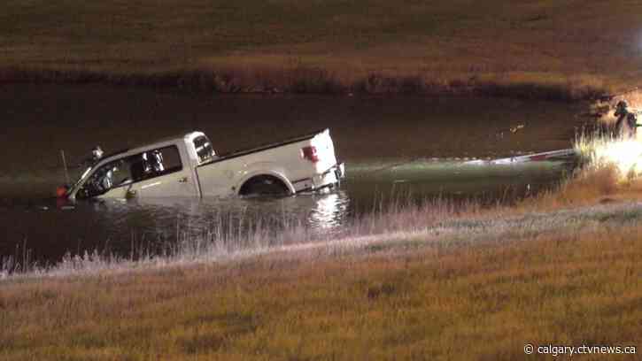 Pickup truck pulled from retention pond along Stoney Trail, no sign of driver