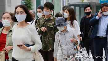 Vaccines, masks? Japan puzzling over sudden virus success