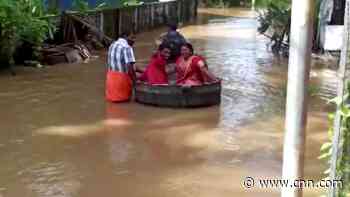 Massive flooding forces couple to float to their wedding in cooking pot