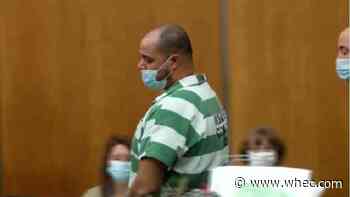 Man accused of murder, shooting at police arraigned on multiple charges