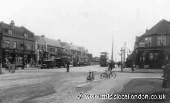 Policeman directs traffic on East London street corner in 1925