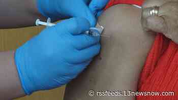 COVID-19 booster crowd get their shots while push for first doses continues