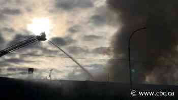 Part of Main Street closed as Winnipeg firefighters battle building fire