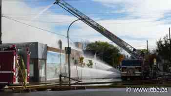 Greek Orthodox church at risk as Winnipeg firefighters battle blaze next door