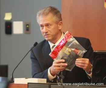 State Police Sgt. Glen Cote with gun linked to shell casings found at murder scene. - Eagle-Tribune