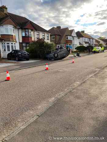 Car flips onto roof in Beech Drive, Borehamwood