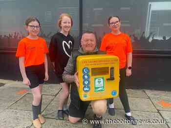 Four girls raise funds to buy a life-saving defibrillator for Bolton community