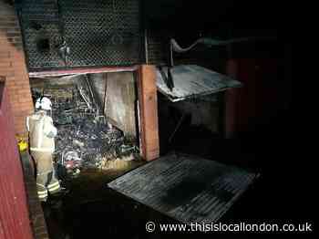 Garages on fire in Mitcham flat block as residents evacuate
