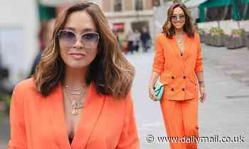 Myleene Klass dons an unmissable orange blazer suit as she heads to the Smooth FM studios