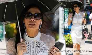Famke Janssen looks summery in a sheer white dress in NYC - Daily Mail