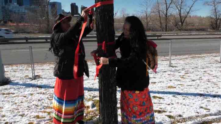 Red ribbons reinstalled at the Field of Crosses after being found in trash