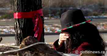 MMIWG ribbons tied to trees again in Calgary after being thrown in trash - Global News