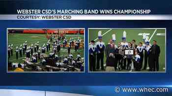 Webster marching band celebrating State Field Band Conference championship win