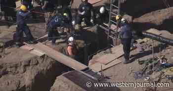 Rescue Caught on Video: Construction Worker Falls Into Trench on the Job, Coworker Jumps In After Him