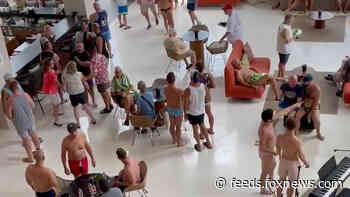Americans at Cancun LGBT+ event in hiding after men with long guns reportedly storm beach