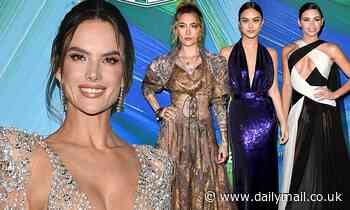 Addison Rae puts her cleavage front and center in a silky black gown at