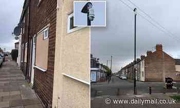 Terrified locals in street in Grimsby cover houses in plywood after spate of crimes - Daily Mail