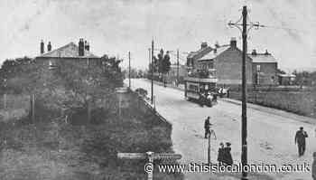 A tram travels along an East London street 115 years ago