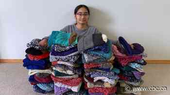 Calgary teen knits 105 hats for annual donation to drop-in centre