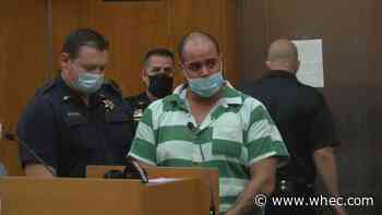 Man accused of murder, shooting at police indicted on several charges
