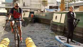 He navigates London's waterways on a floating bike to clean up plastic pollution