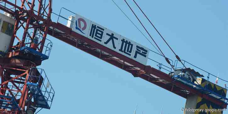 Investors are waiting on an overdue $148 million bond payment from Evergrande, the world's most indebted company - and it has to go through today