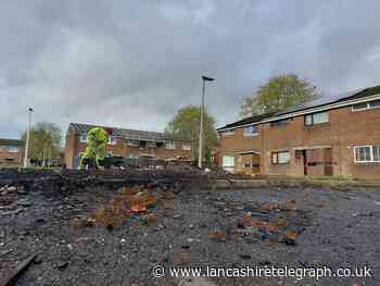 Workers clear up huge mess on Blackburn estate following illegal bonfire