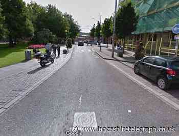 Robber punches man in Blackburn town centre