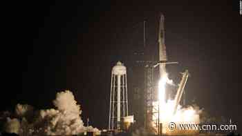 SpaceX capsule, carrying four astronauts, docks with the International Space Station