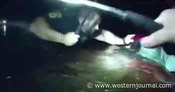 Video: Woman Moments from Drowning in Sinking Car, Then Police Arrive and Break Back Window