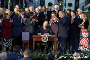 Biden signs infrastructure bill, marking victory in hard-fought legislative battle