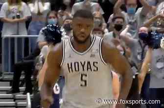 Timothy Ighoefe puts down a dunk to help Georgetown extend lead over American, 27-22
