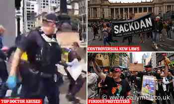 Moment Brett Sutton ambushed by feral anti-Covid vaccine protesters at Victorian state parliament - Daily Mail