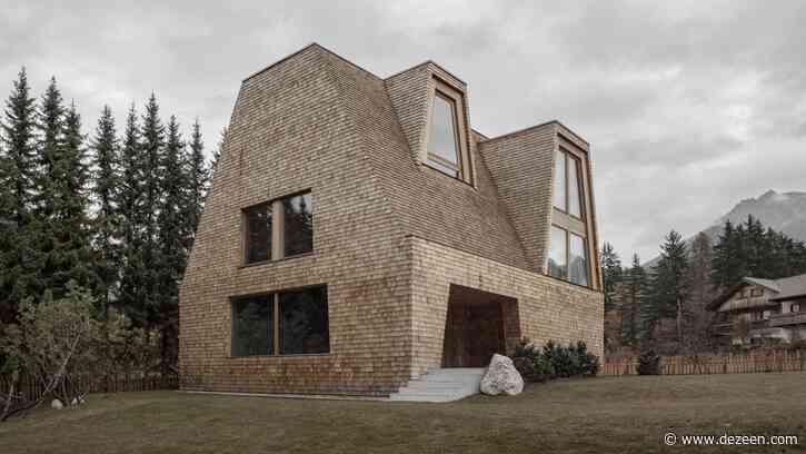 Shingles made from salvaged spruce wood cover Alpine house in Italy