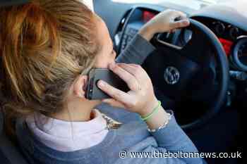 Drivers to be banned from scrolling through playlists while holding phones